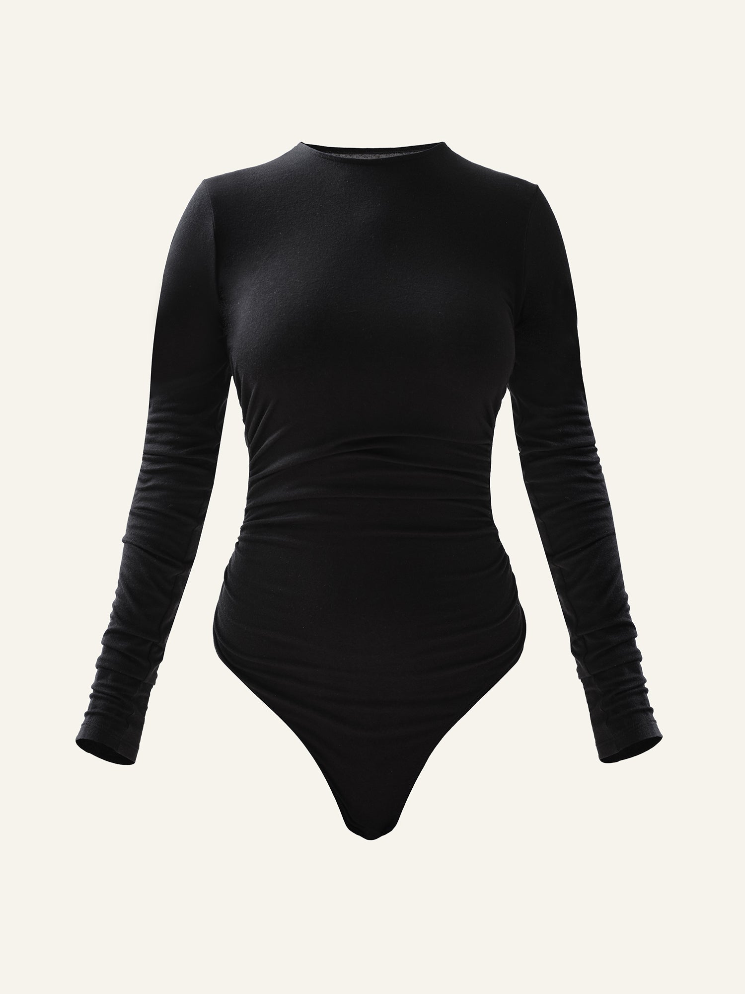 Product photography of a black long sleeved bodysuit with draping at the sides and high round neckline 