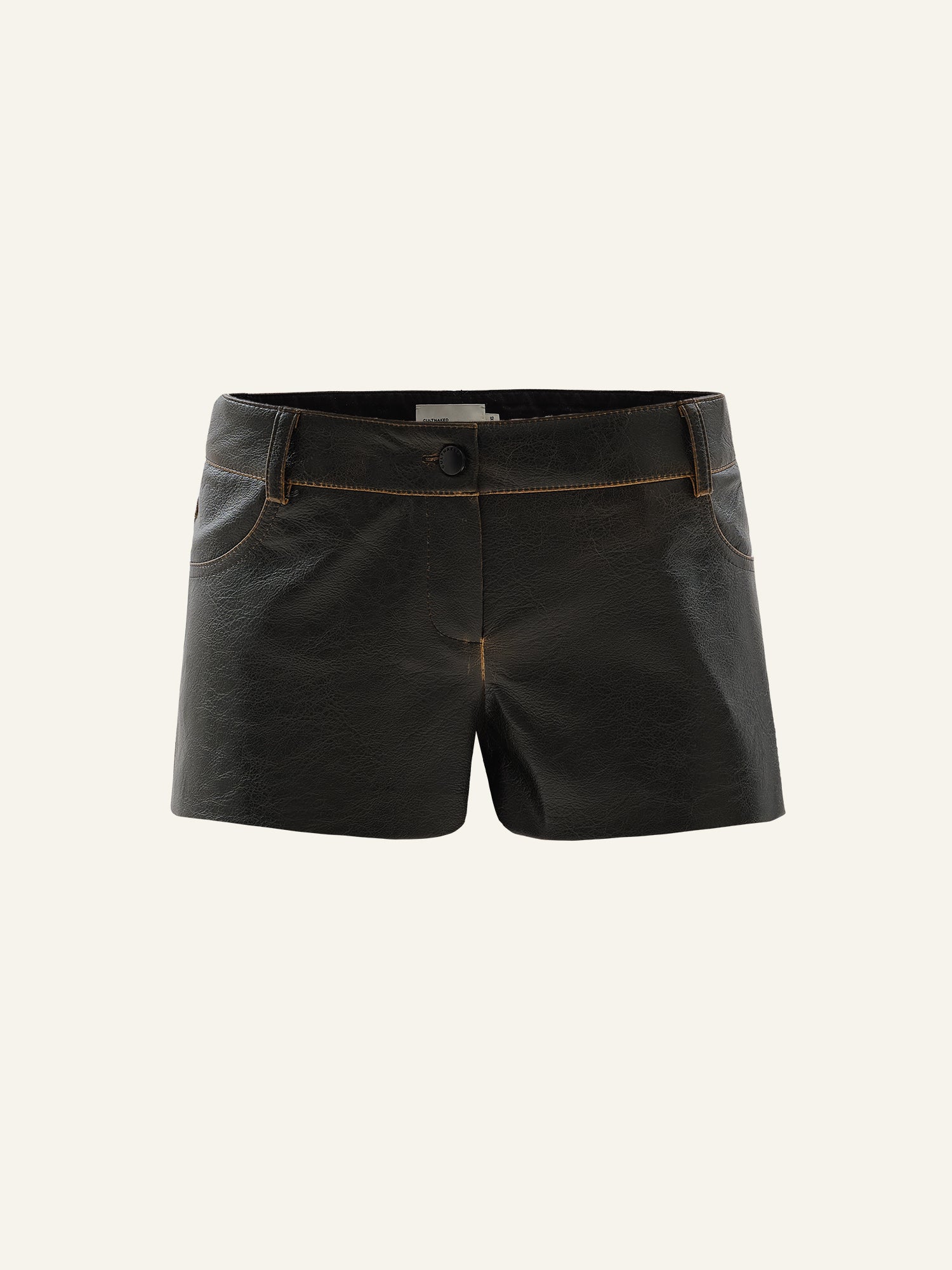 Product photo of a brown vegan  leather mini shorts with mid rise