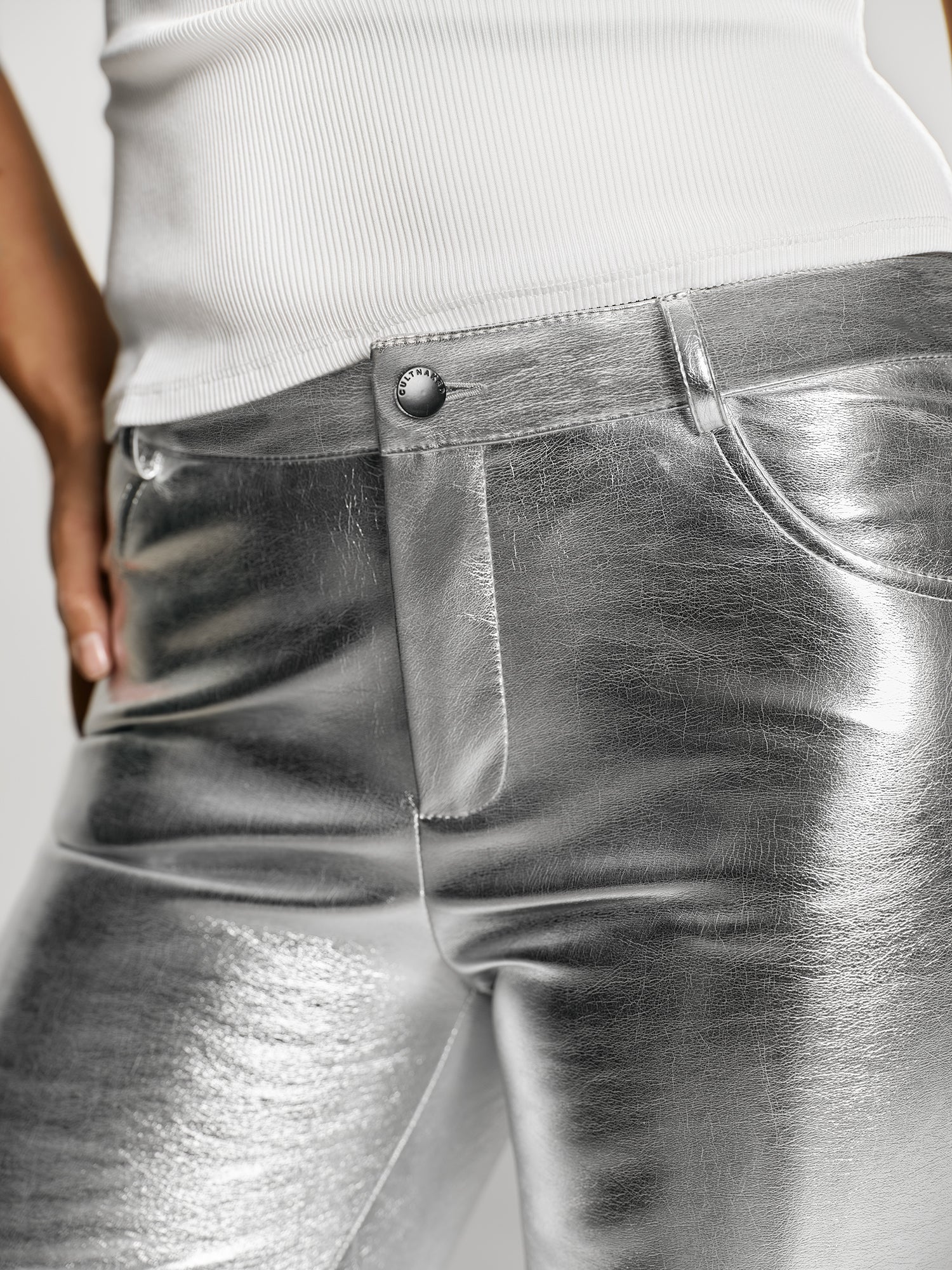 Girl in silver color trousers