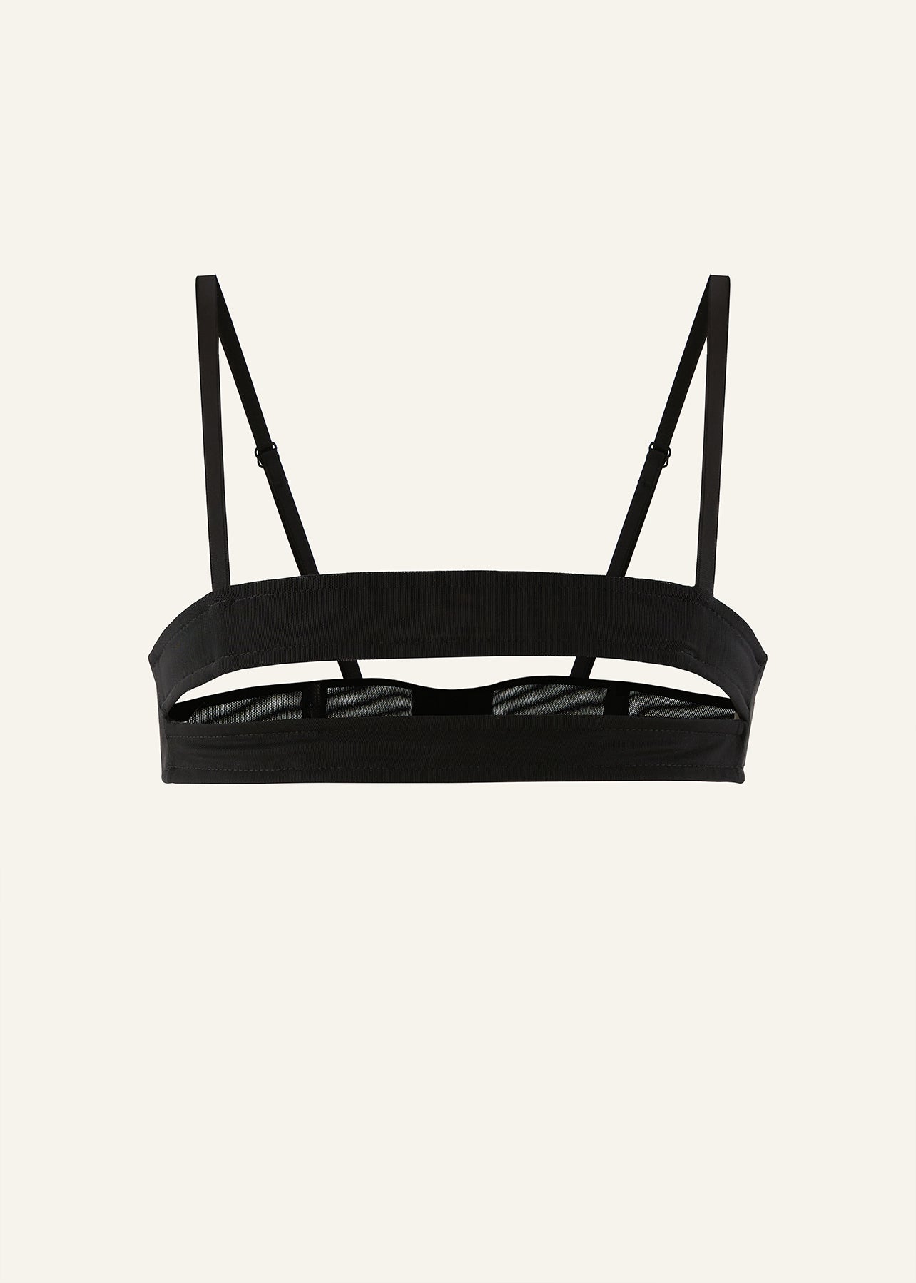 Product photography of a black mesh croptop with horizontal cut