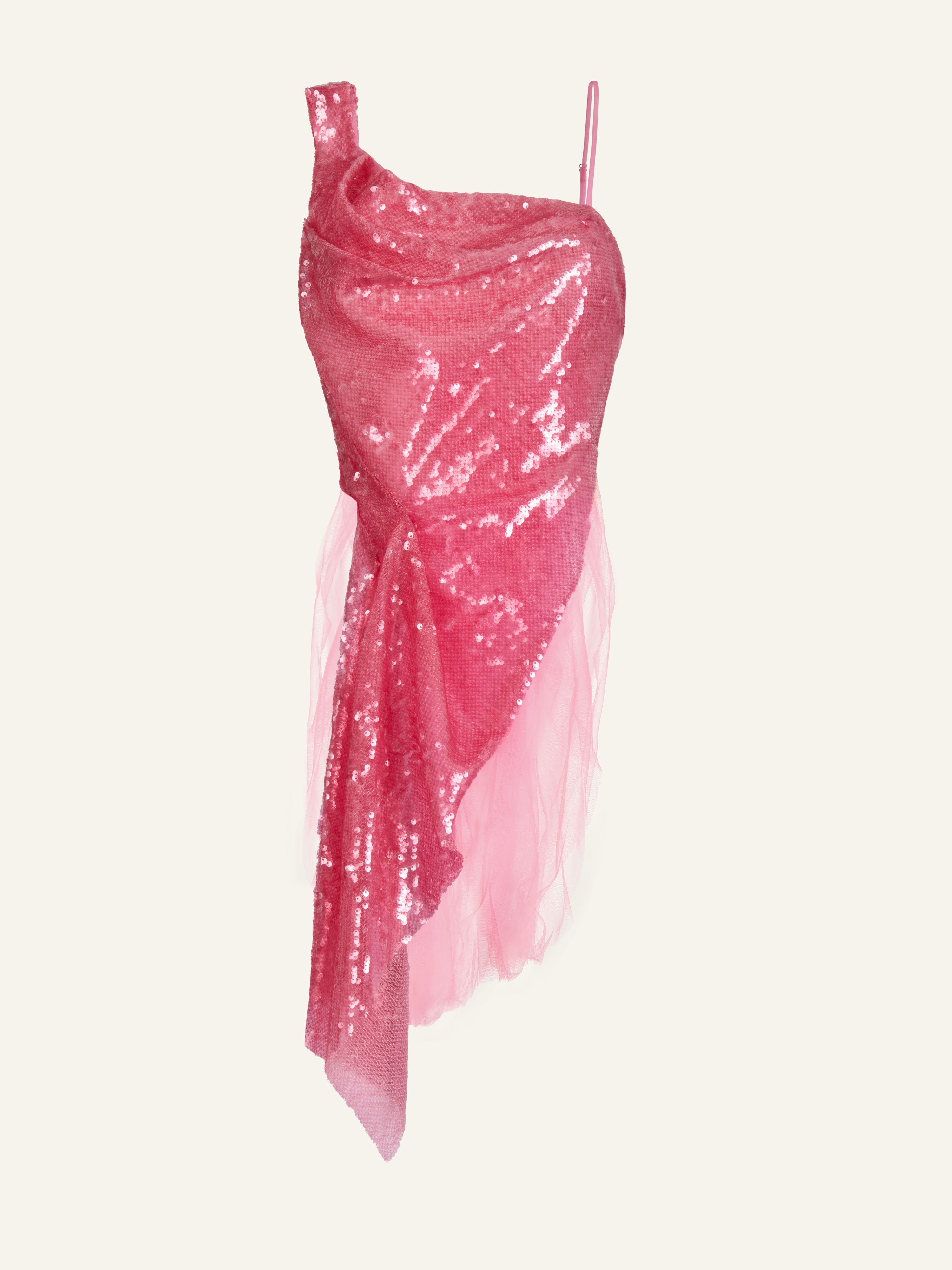 Product photography of a pink sequinned one shoulder top with asymmetric hem in the front